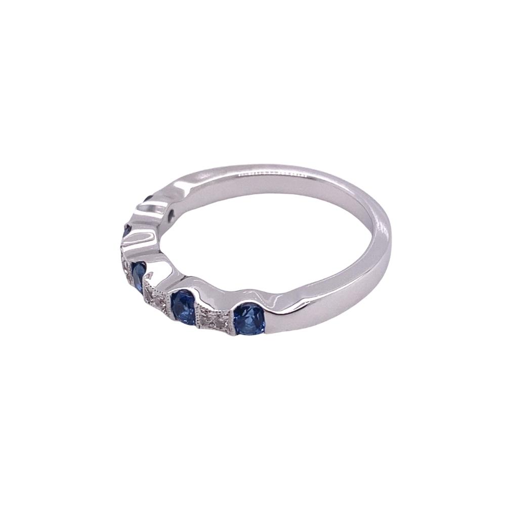 a white gold ring with blue sapphire stones