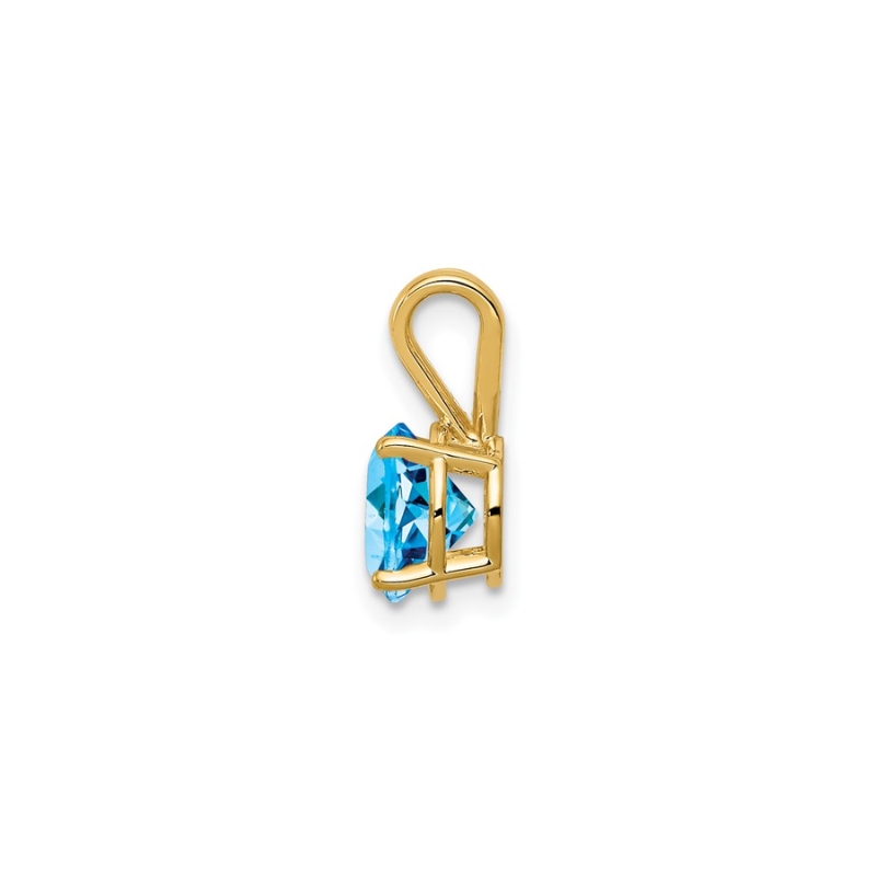 a gold pendant with a blue stone