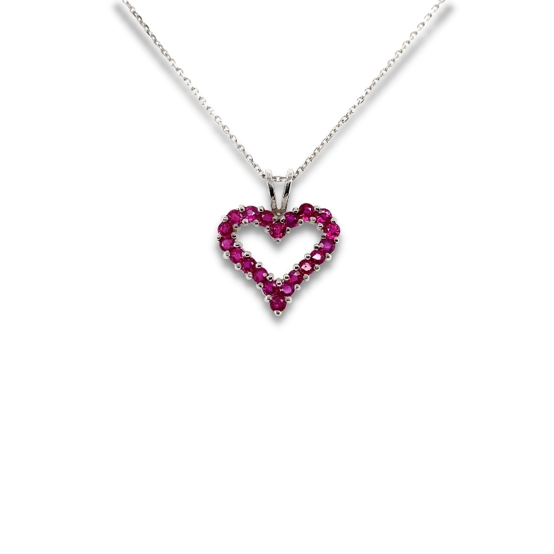 a heart shaped pendant with pink stones