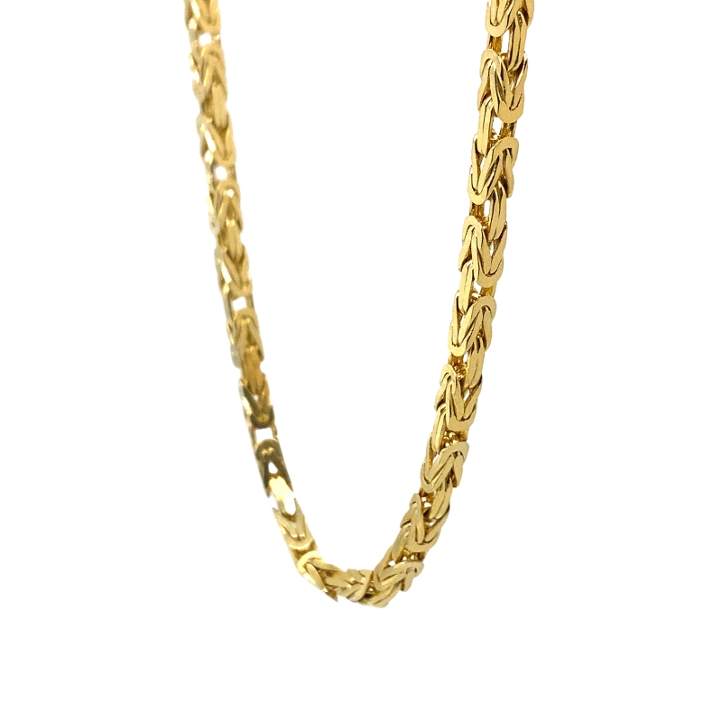 a gold chain is shown against a white background