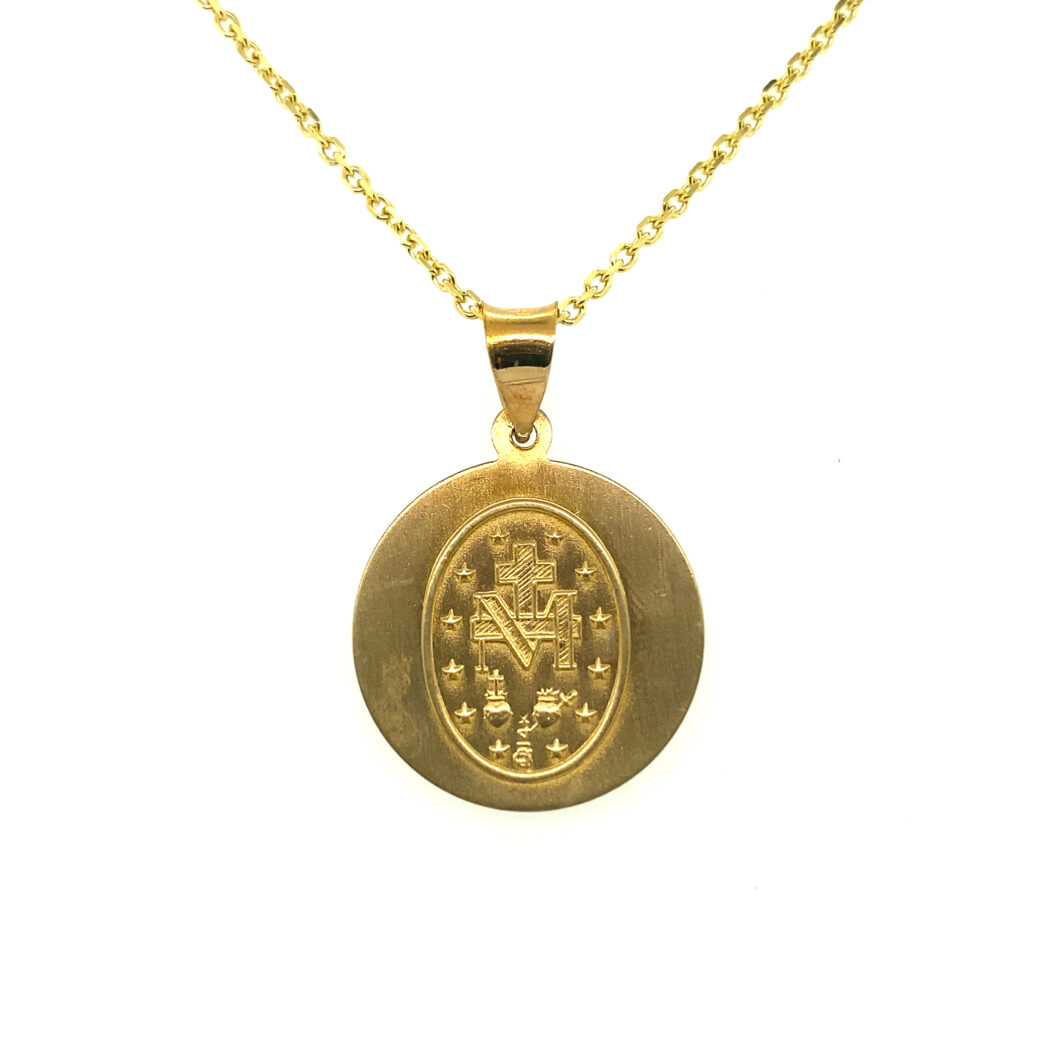 a gold necklace with a medallion on it