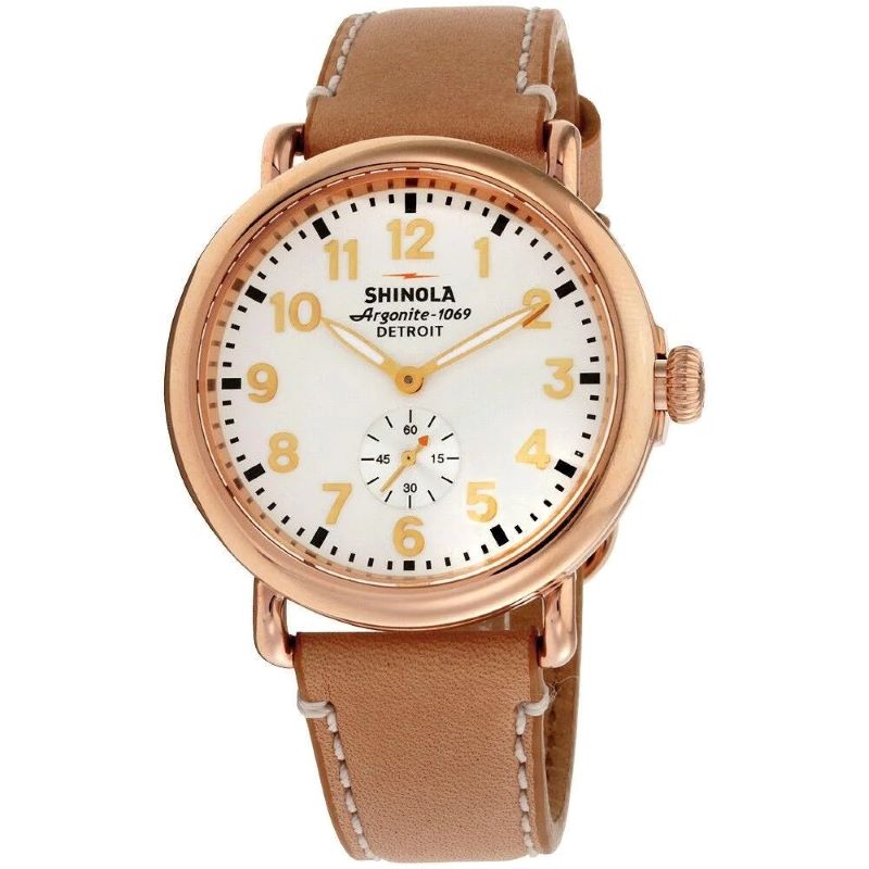 a brown watch with white dials and tan leather strap