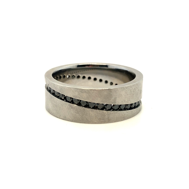 a wedding ring with black diamonds on it