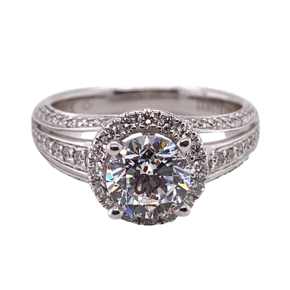 a white gold ring with a diamond center