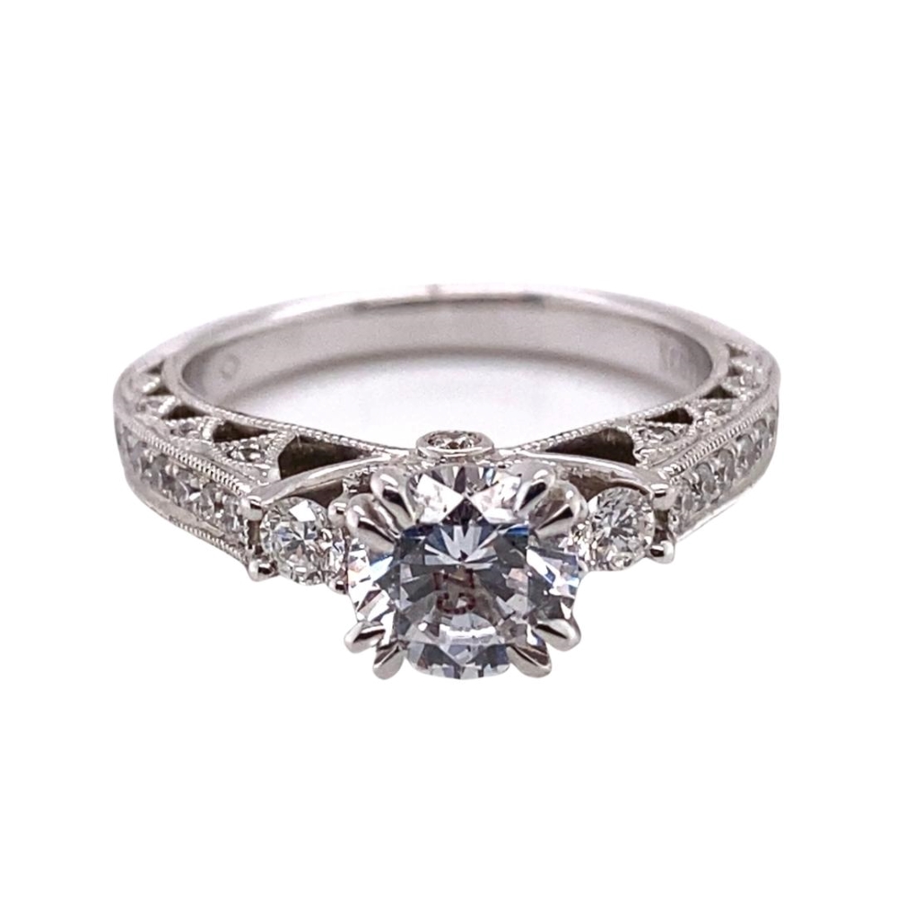 a white gold engagement ring with a center diamond