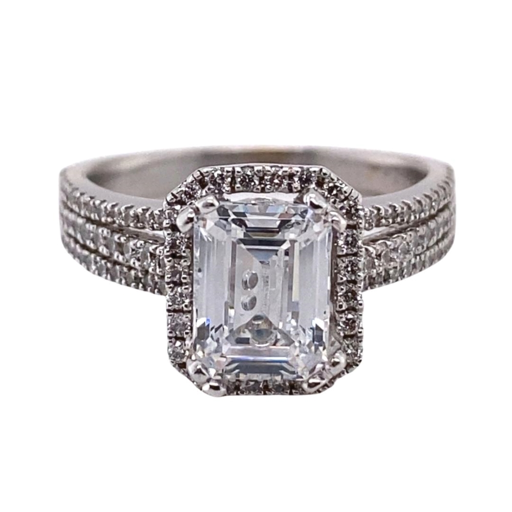 an engagement ring with a square cut diamond surrounded by pave diamonds