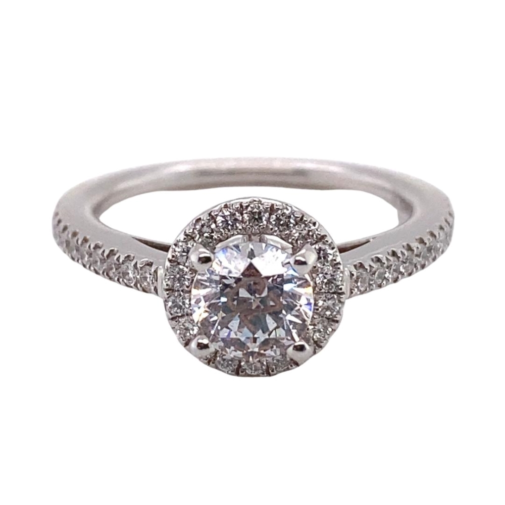 a white gold ring with a diamond center