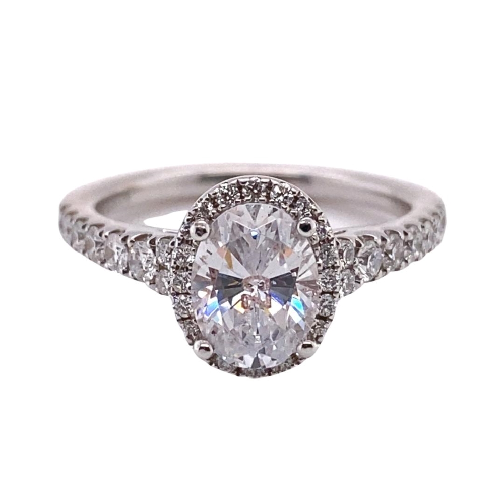 a white gold ring with a large diamond center