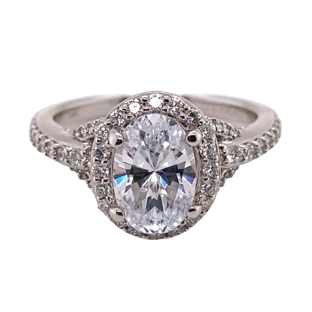 a white gold ring with a large oval cut diamond