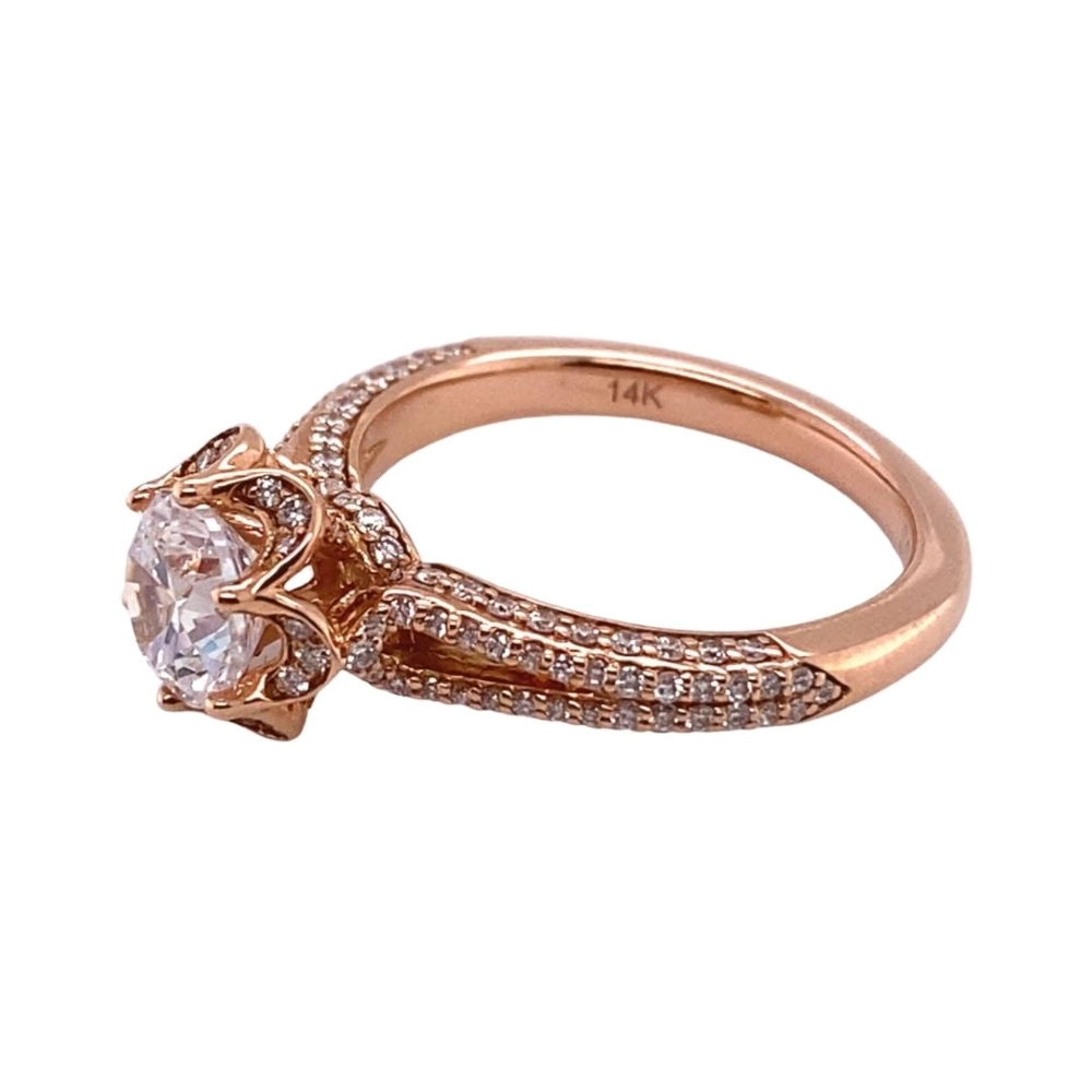 a rose cut diamond engagement ring set in 18 karat gold