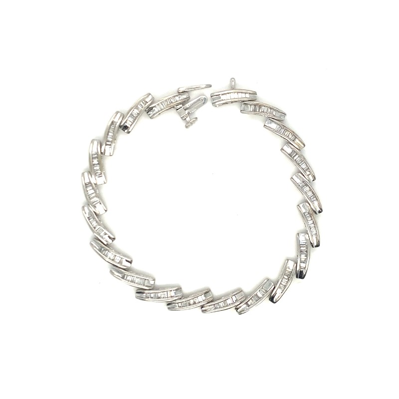 a white bracelet with small diamonds on it