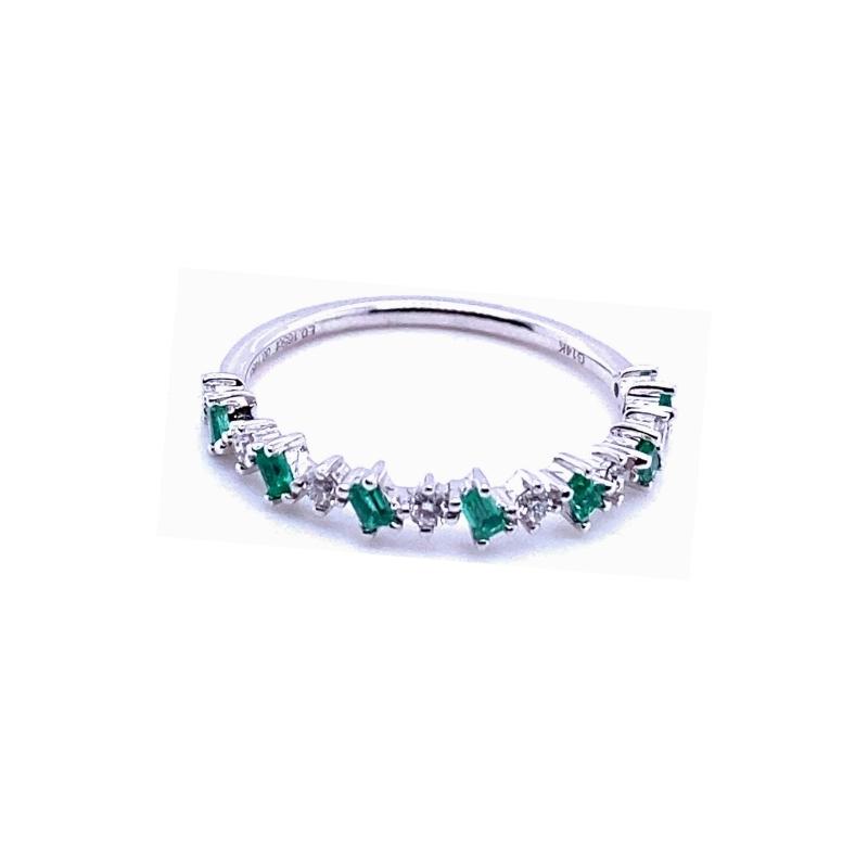 a white gold ring with green and white stones