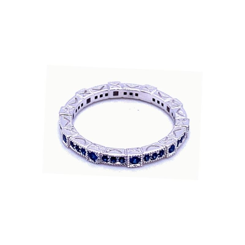 a white gold and blue sapphire band