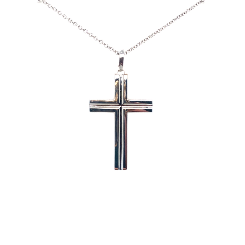 a silver cross necklace on a white background