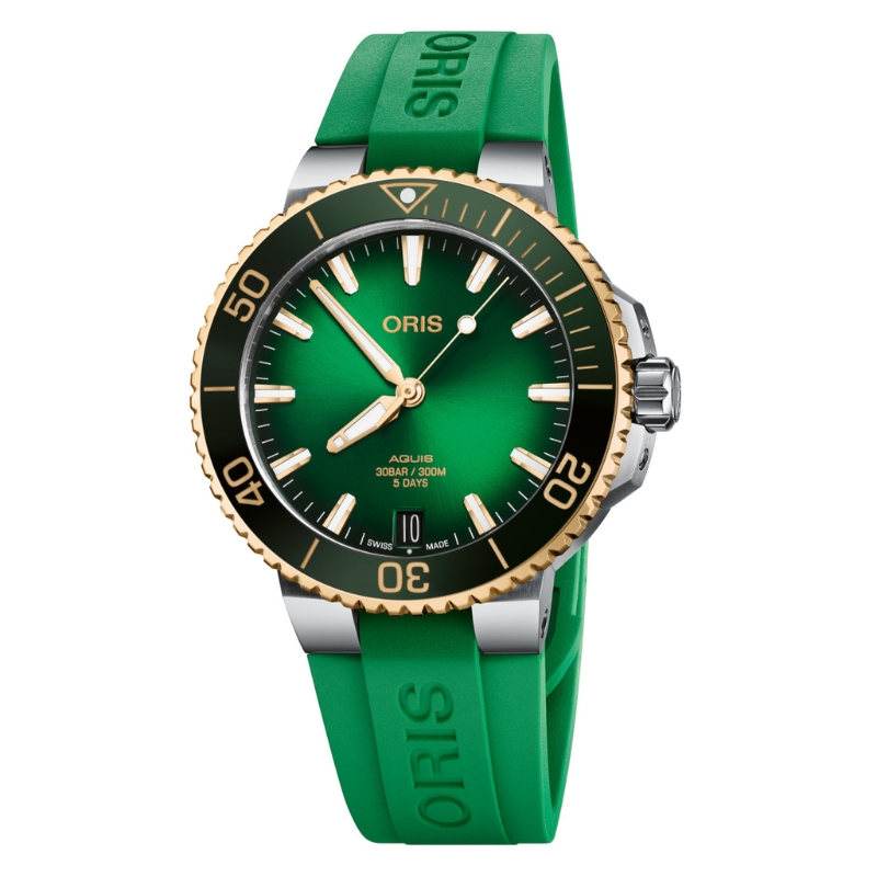 a green watch with gold accents on the face