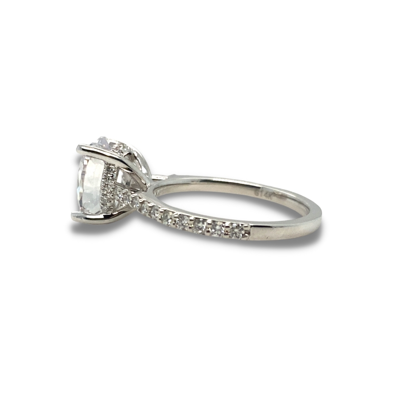 a white gold engagement ring with an oval cut diamond