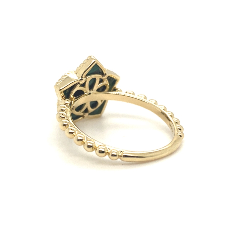 a gold ring with an ornate design on it