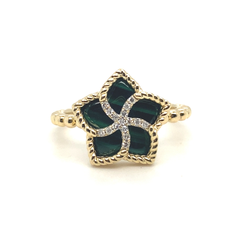 a gold ring with green glass and diamonds