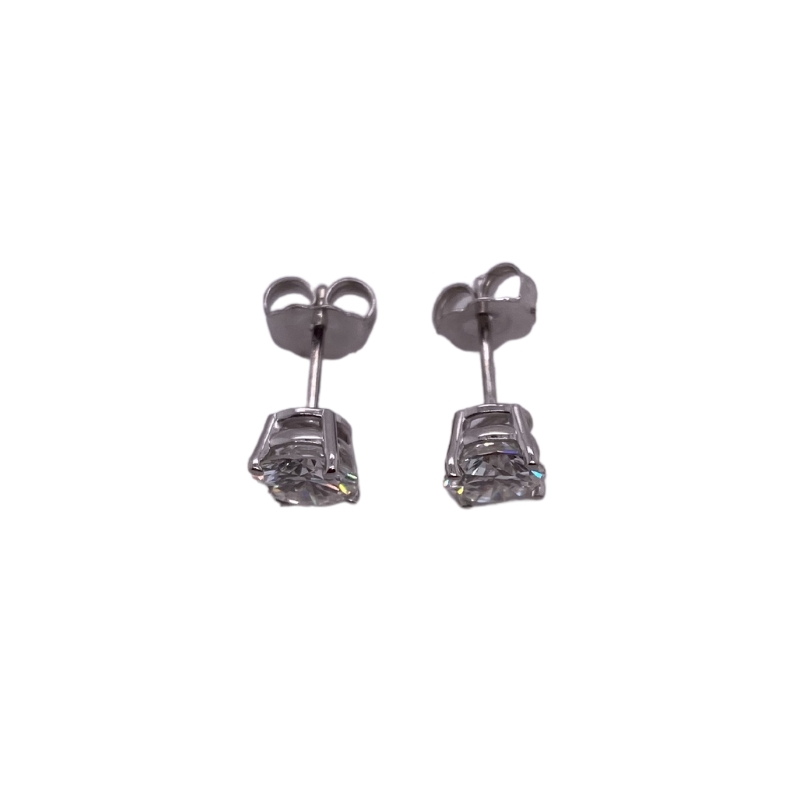 a pair of earrings with cubics on them