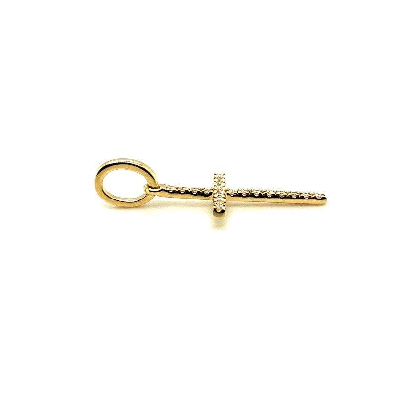 a gold cross charm on a white background