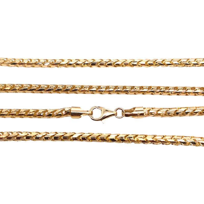 three gold chains on a white background