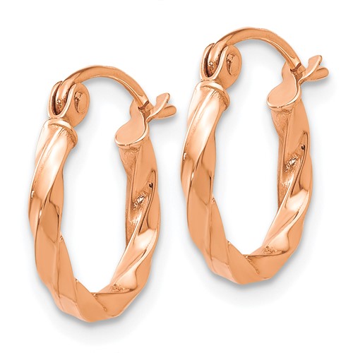 a pair of rose gold hoop earrings