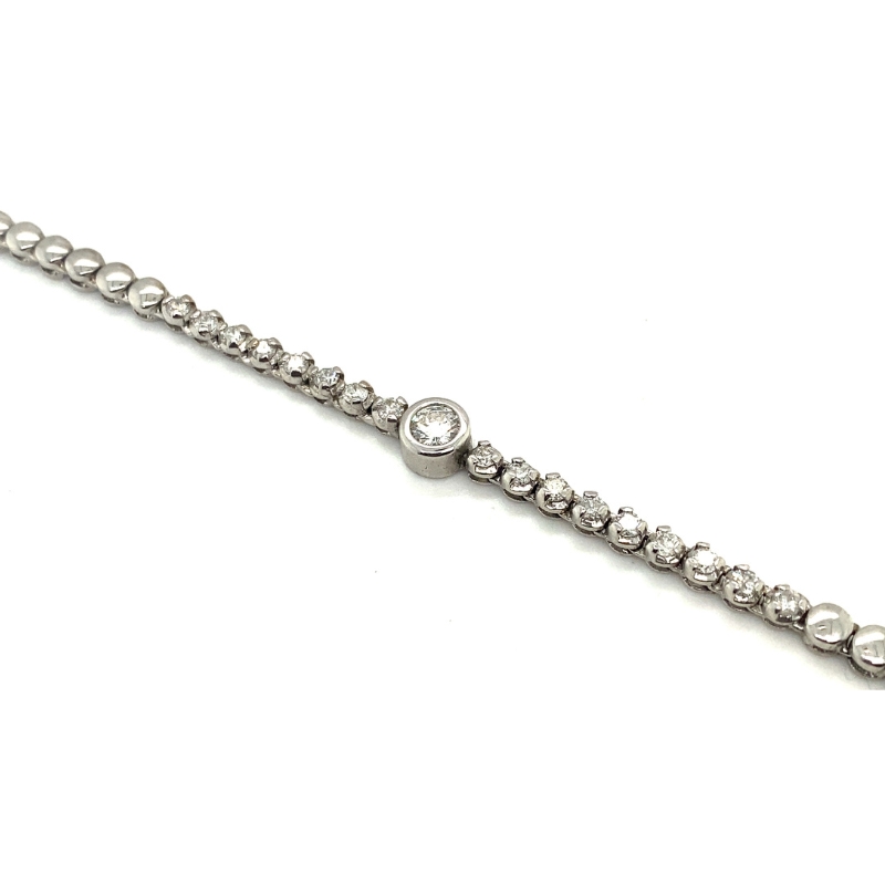 a silver bracelet with beads on it