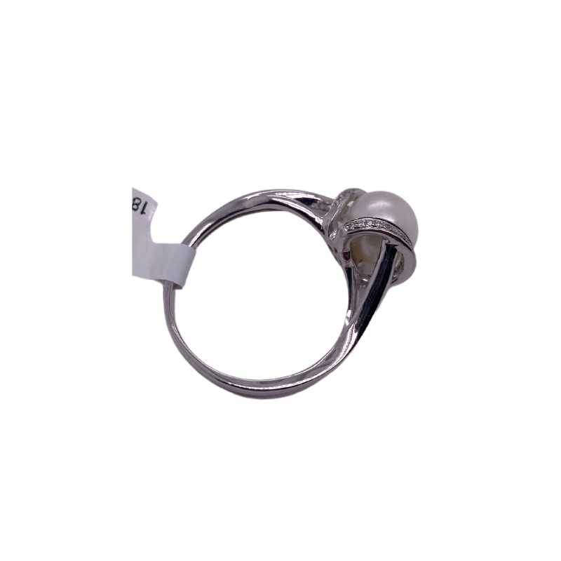 a silver ring with a ball on it