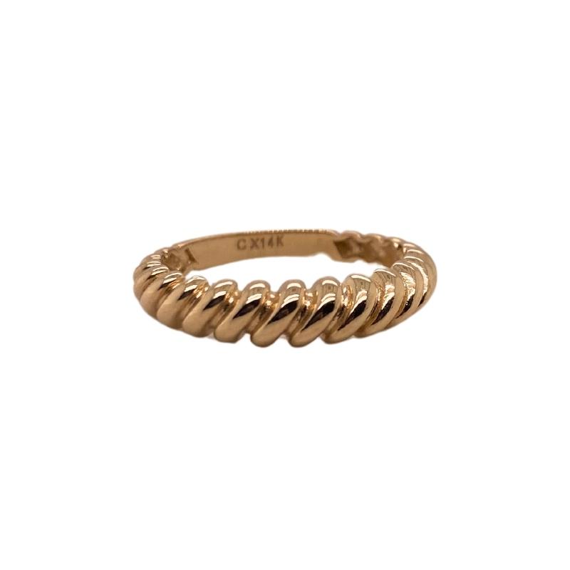 a gold ring with twisted design on it
