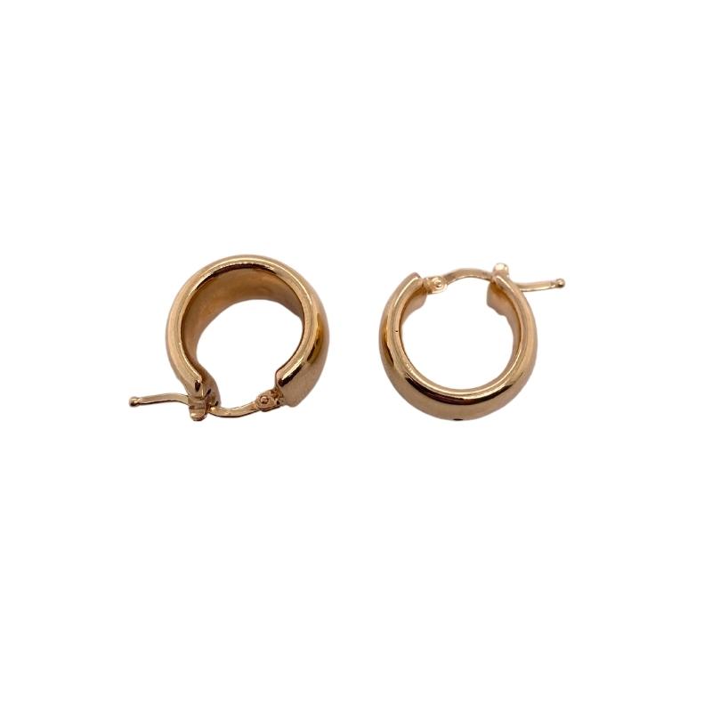 small gold hoop earrings on a white background