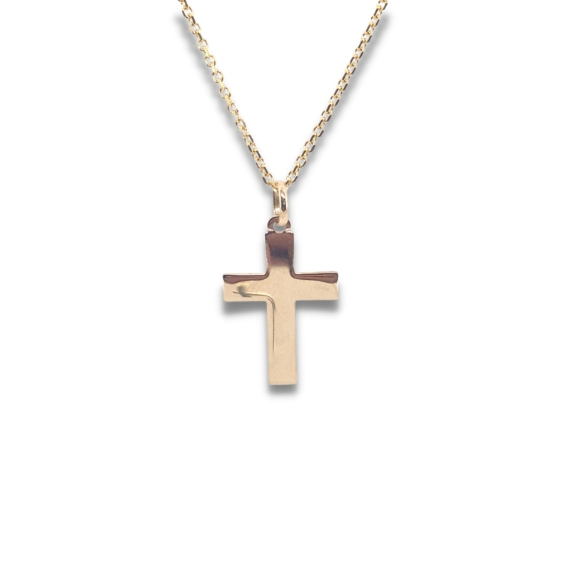 a gold cross necklace on a white background