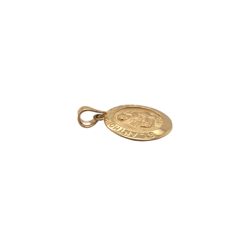 a gold coin charm on a white background
