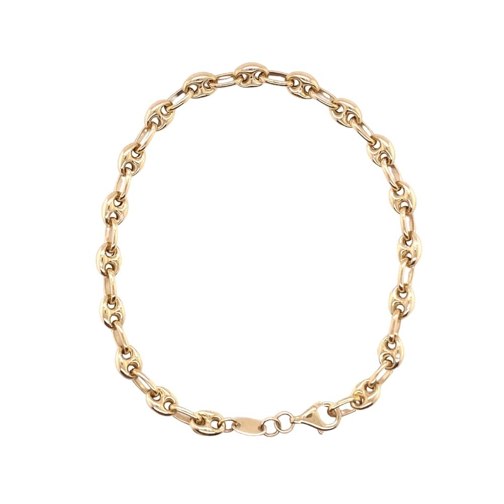 a gold chain bracelet on a white background