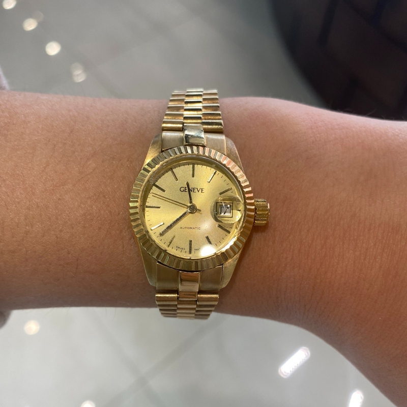 a woman's wrist with a watch on it