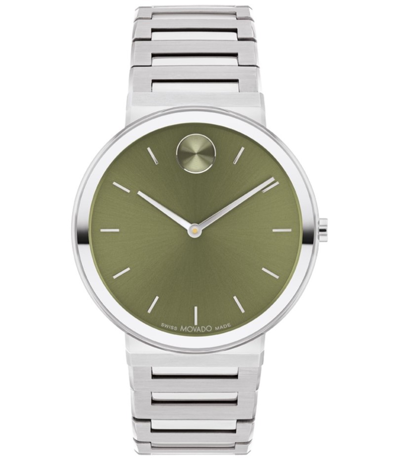 a watch with a green dial on the face