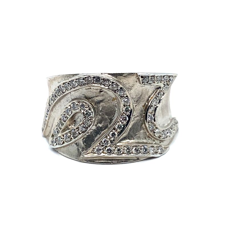 a silver ring with diamonds on it