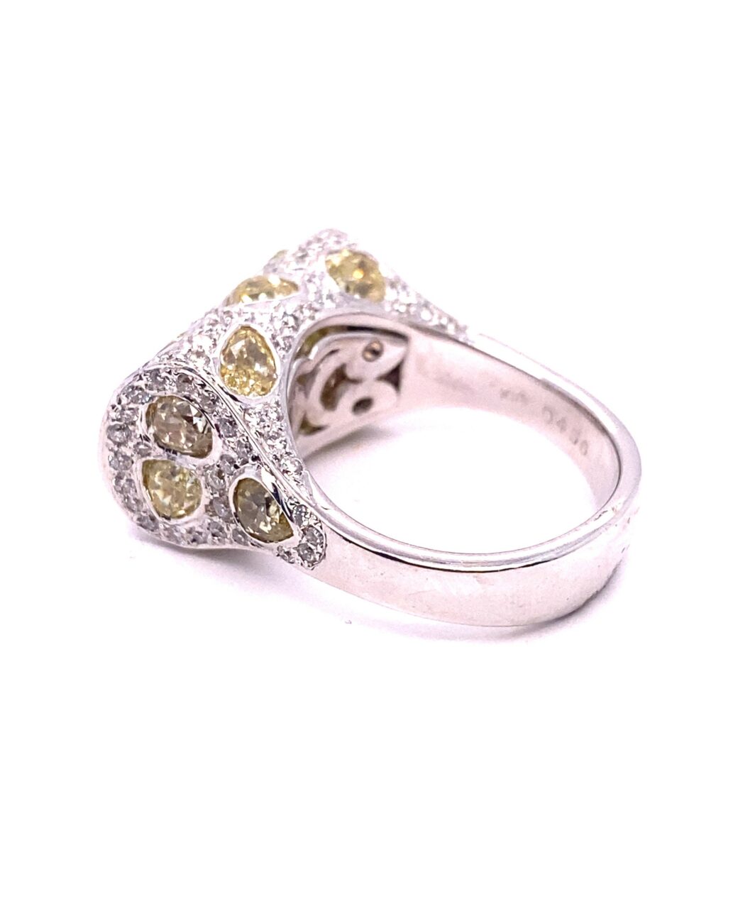 a fancy ring with yellow and white diamonds