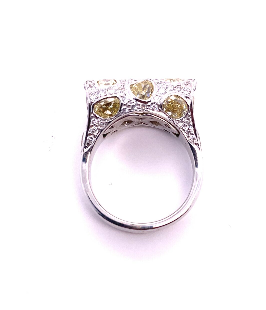a fancy ring with yellow and white diamonds