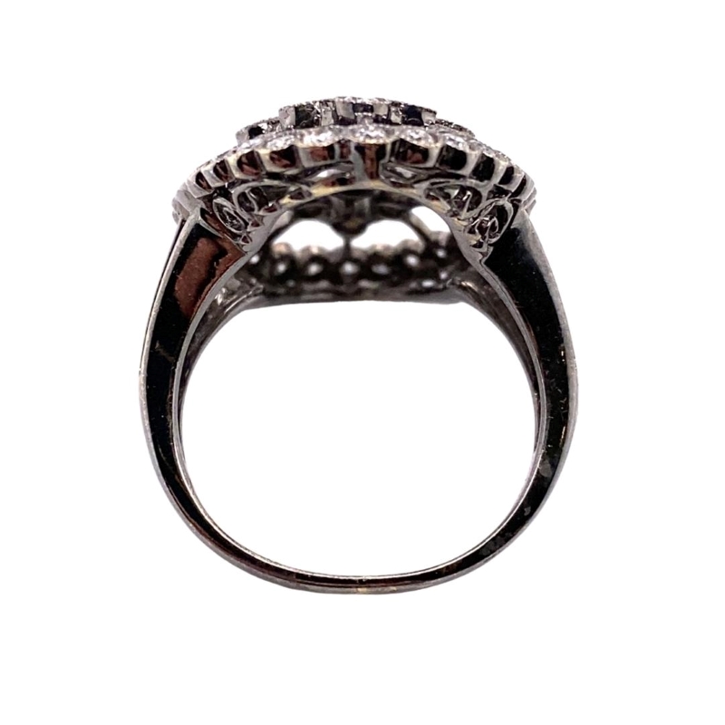an antique style ring with three rows of diamonds