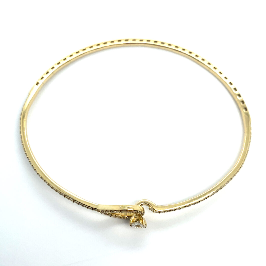 a gold bracelet with a diamond clasp