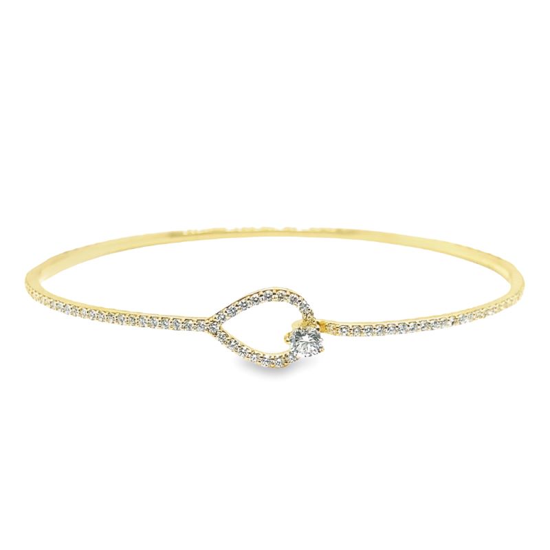 a gold bracelet with a diamond heart on it