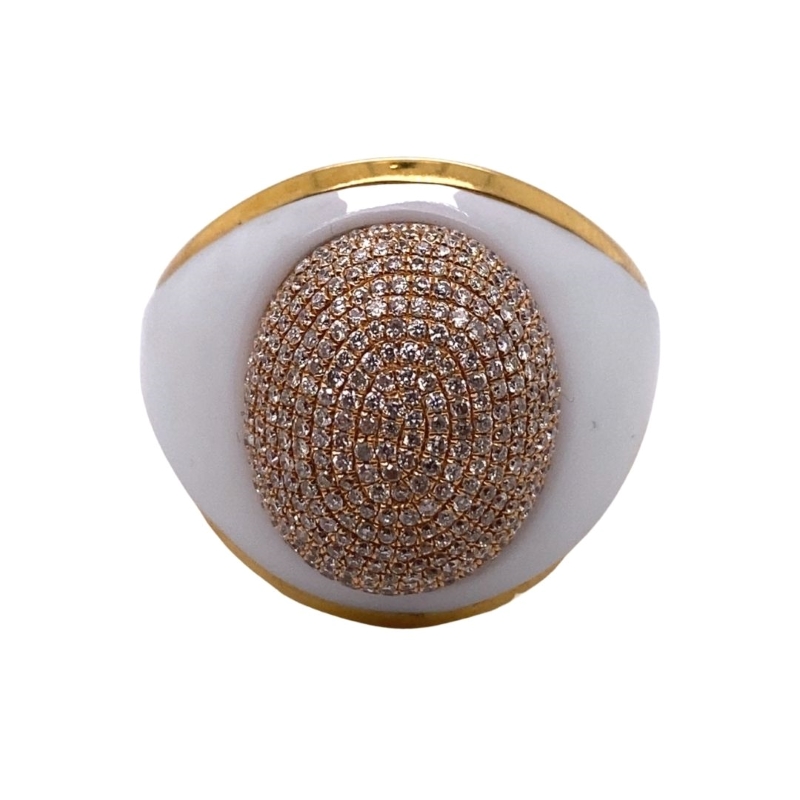 a white and gold ring with brown stones
