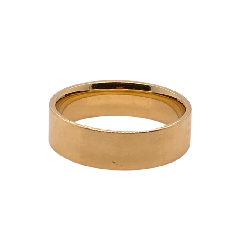 a gold wedding ring on a white background
