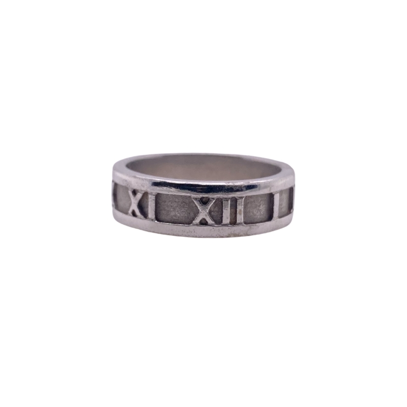 a silver ring with roman numerals on it