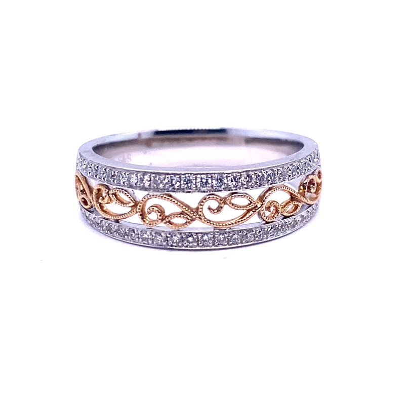 a white and gold ring with diamonds on it