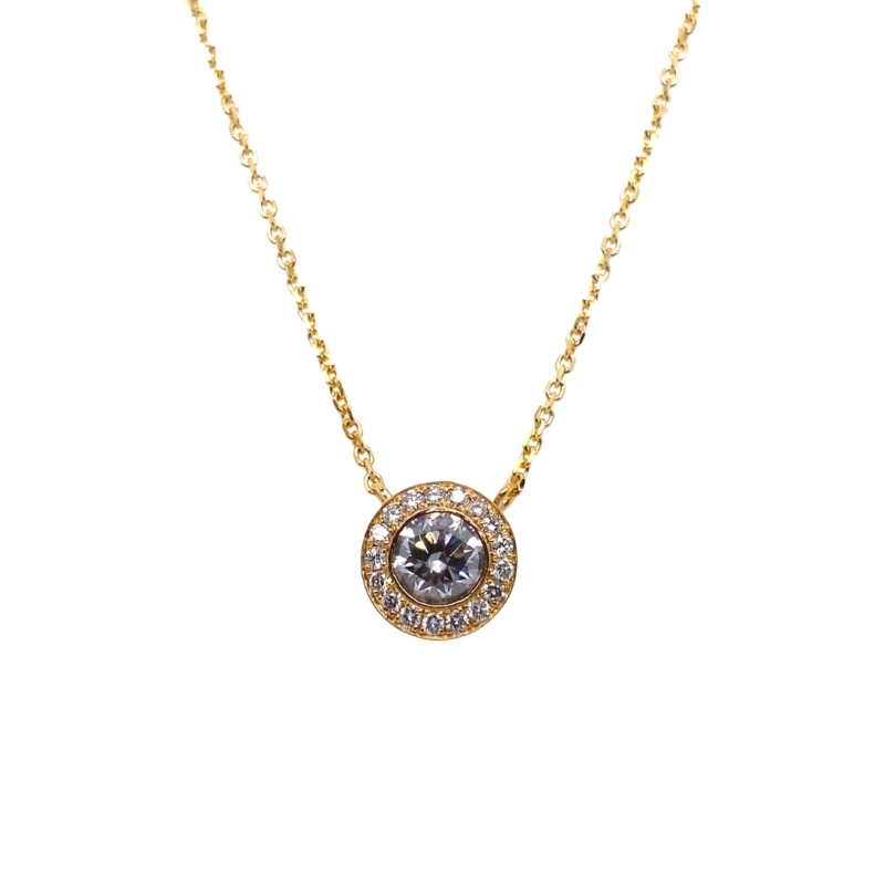 a gold necklace with a white diamond in the center