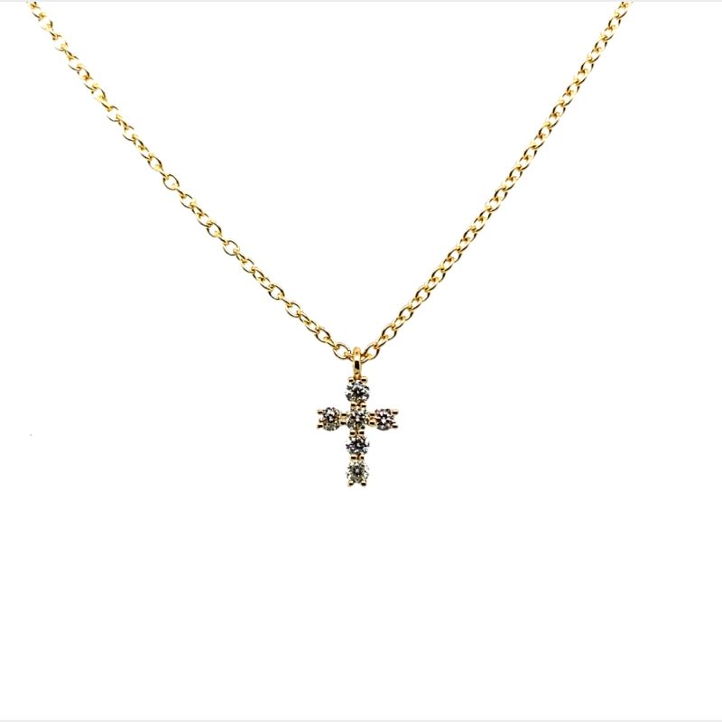 a cross necklace on a gold chain