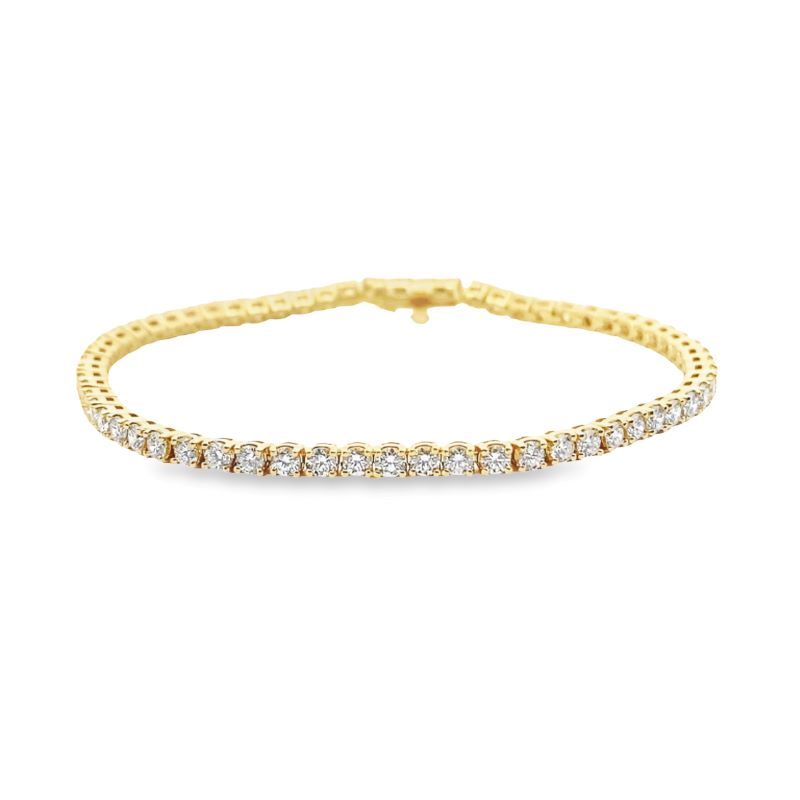 a yellow gold bracelet with diamonds