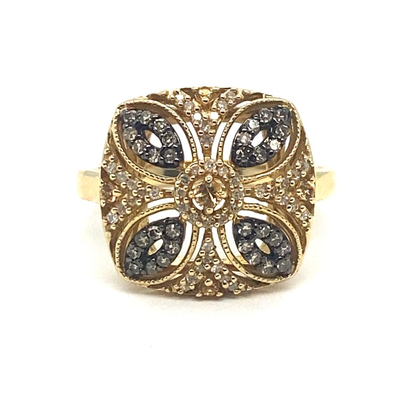 a gold ring with black and white diamonds