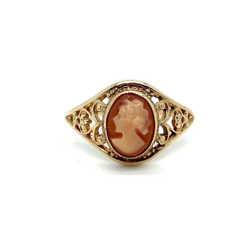 a gold ring with an oval stone in the center